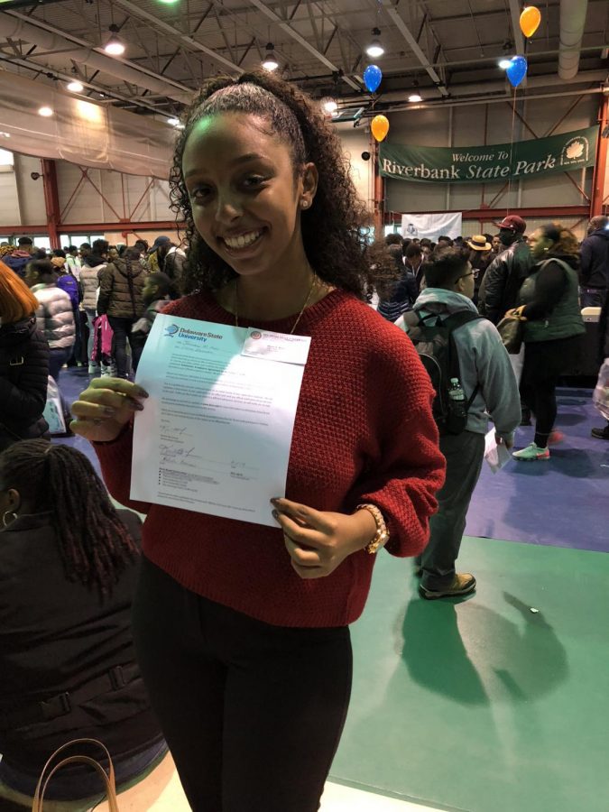 Lydia Abraham smiling after being awarded her full scholarships.