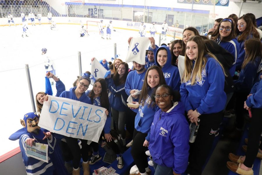 The Bomb Squad cheers on the Blue Devils at Tuesday nights game.