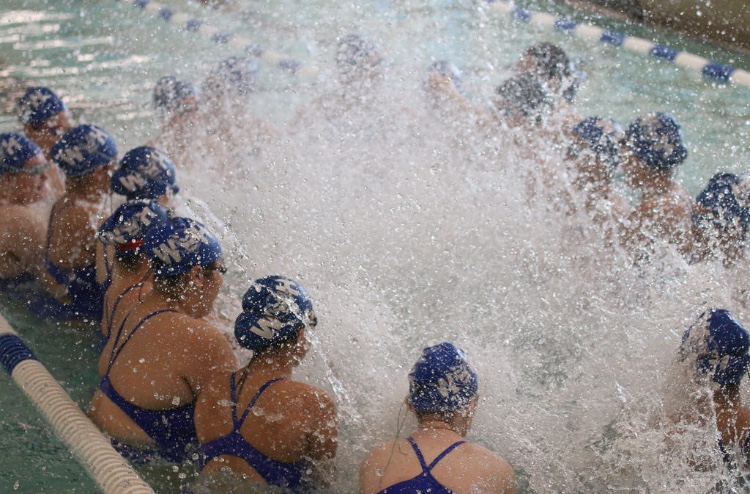 The West Haven Girls Swim and Dive team does one of its pre-game cheers.