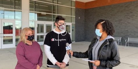 Reporter Rodjae Smith interviews sophomore Dominic Konareski and his mother, Michelle Konareski, about the student health center in a video aired by Fox 61 Student News.