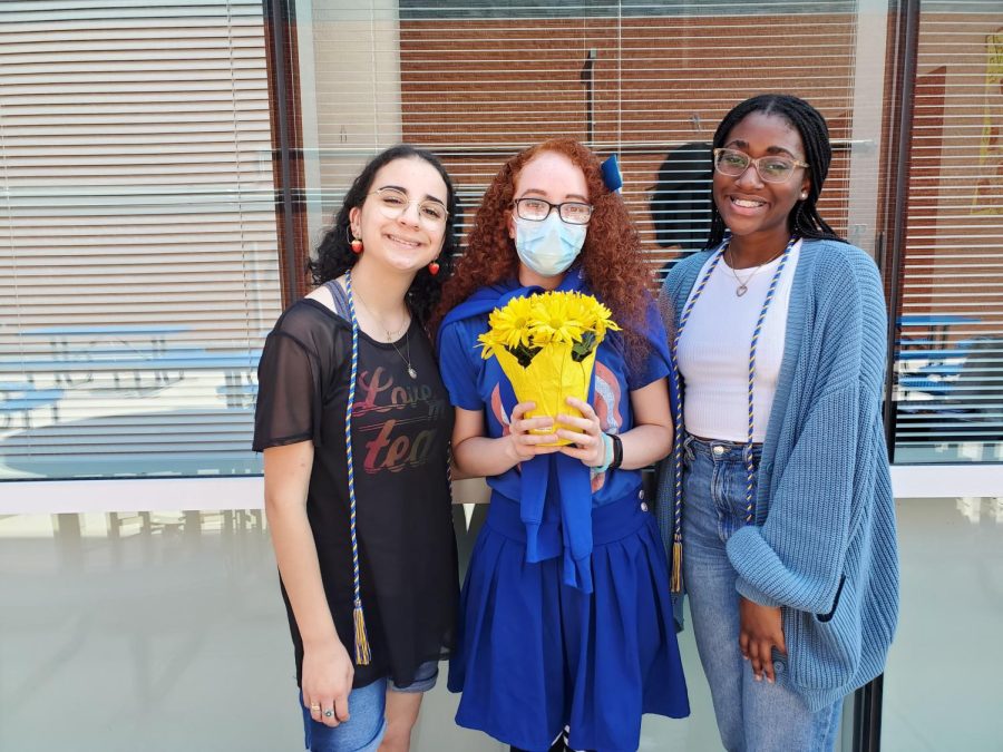 The two most recent editor in chiefs, Sabrine Yaser (left) and Danielle Ricketts (right), with new editor-in-chief Nevaeh Lugo. 