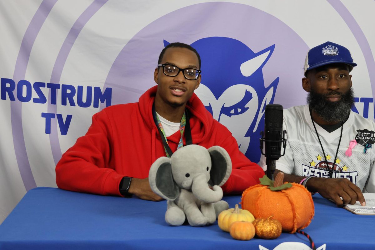 Weatherman Devon Nichols reports the weather with guest anchor Levi Jordan, an outreach worker at our school.